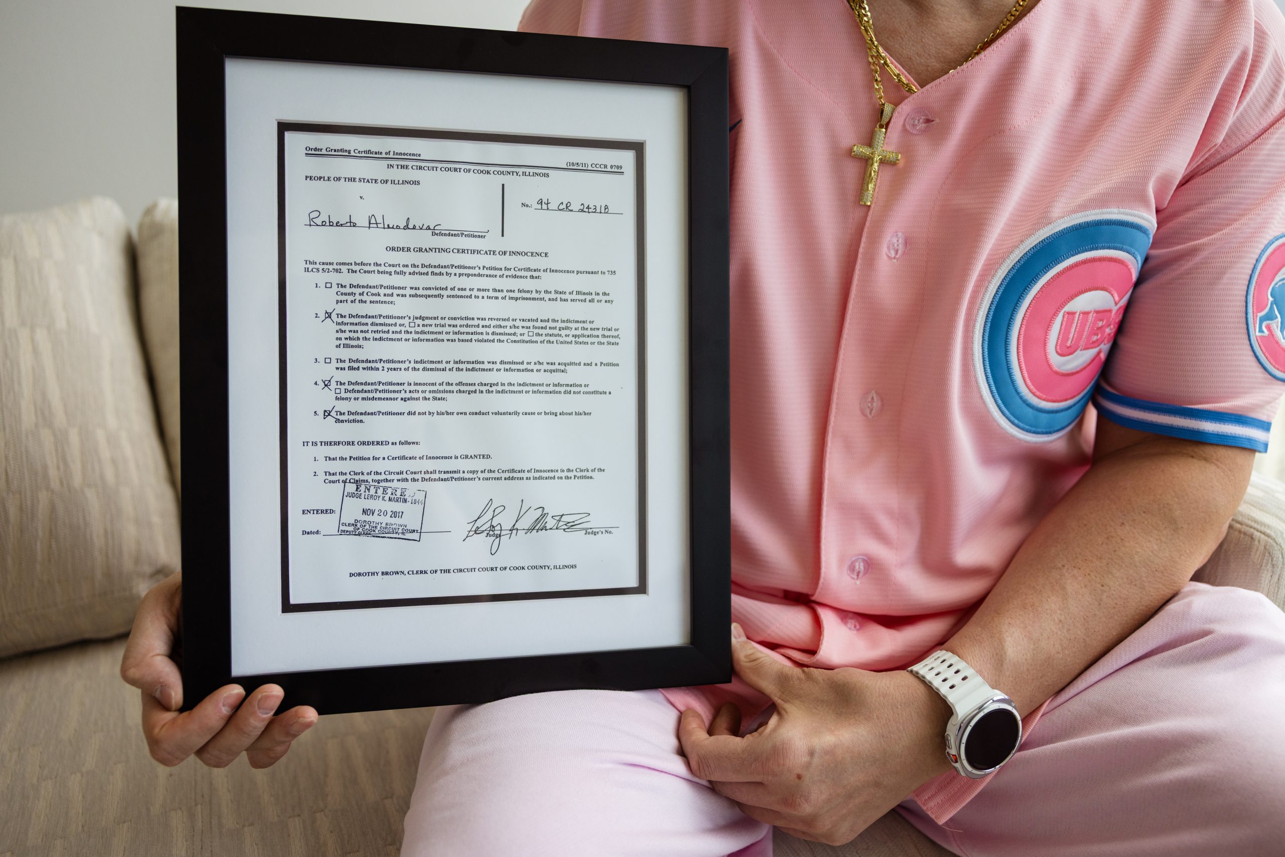 A photograph of Roberto Almodovar's framed certificate of innocence. Taylor Glascock for Injustice Watch and Bolts.