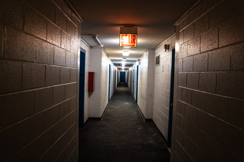 A dark apartment building hallway